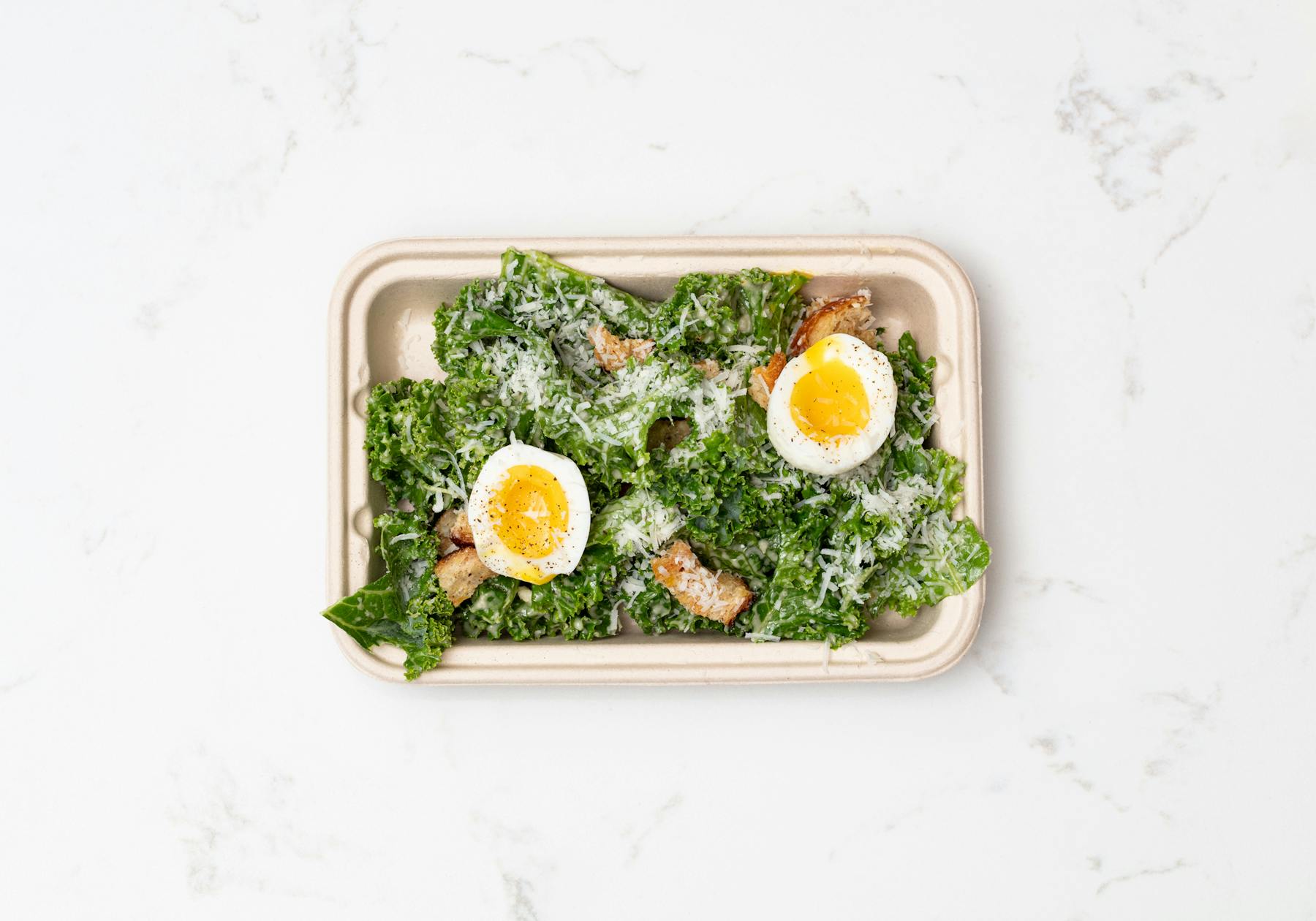 a tray of food with broccoli