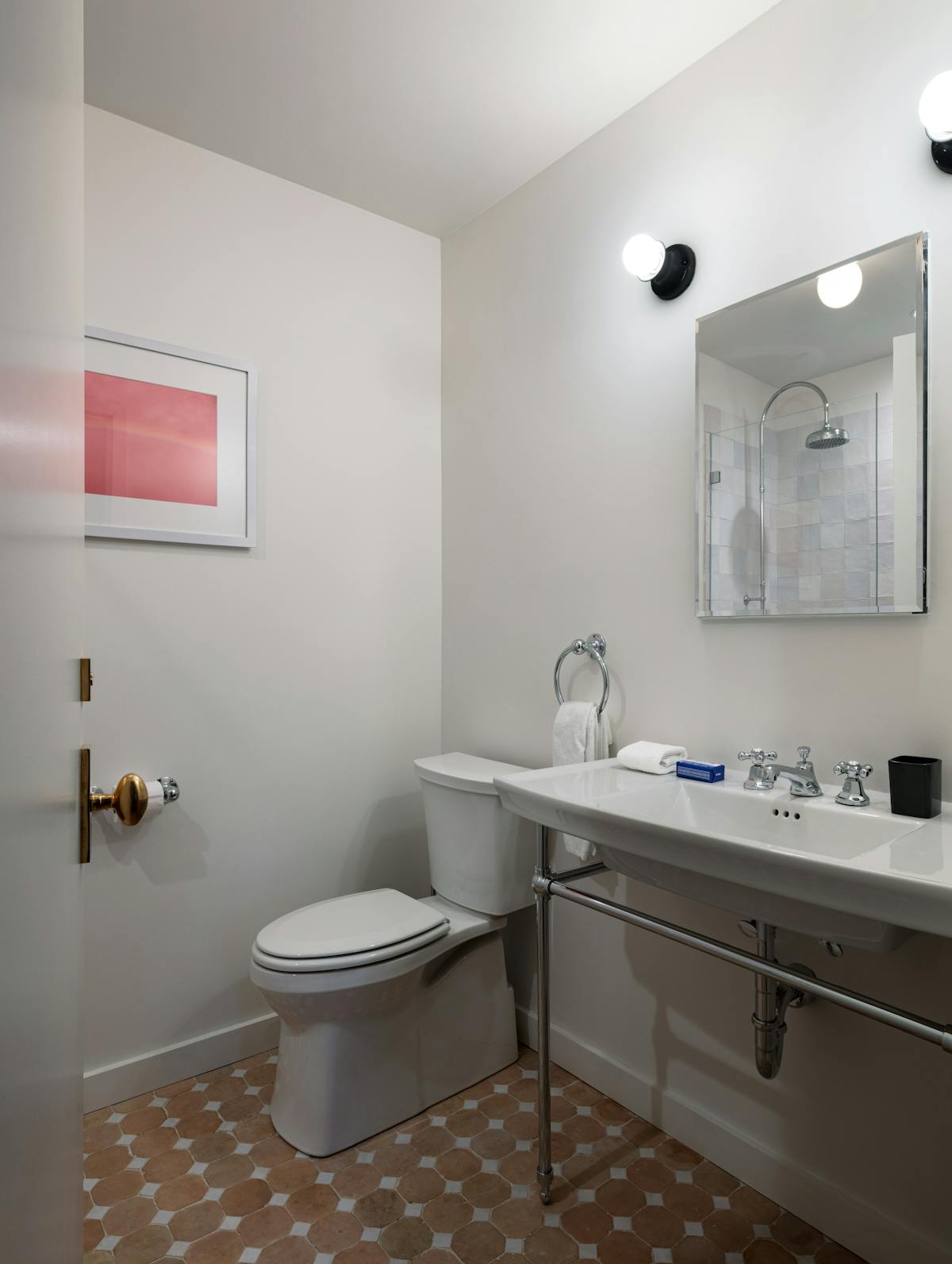 a room with a sink and a mirror
