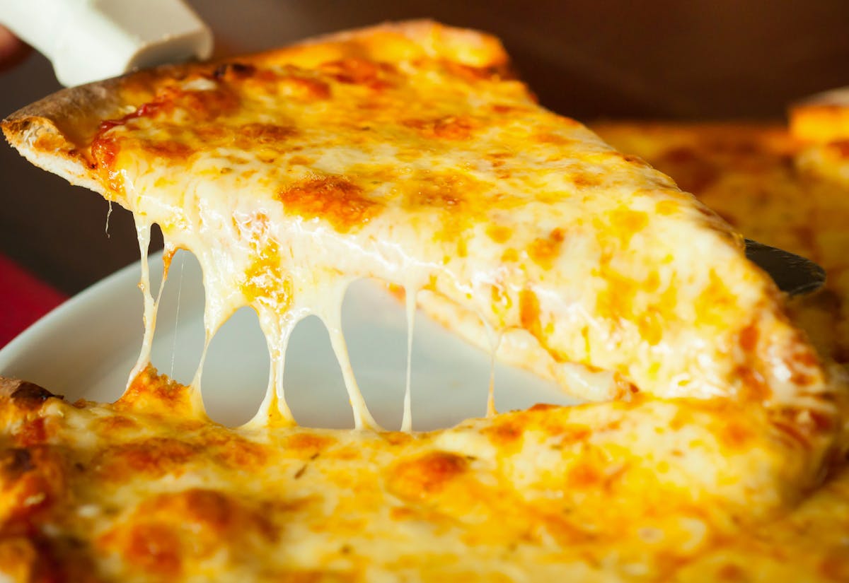 a close up of a slice of pizza
