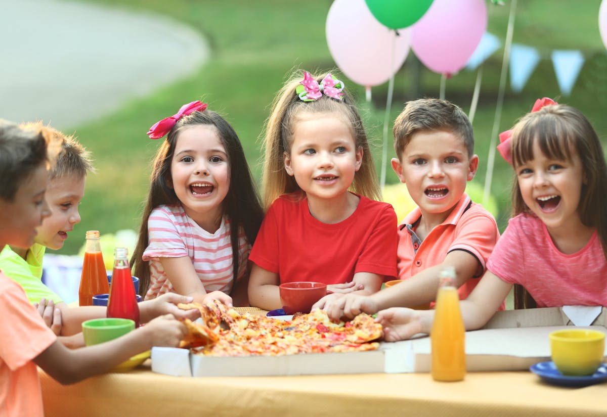 Image of a group of kids at a pizza party