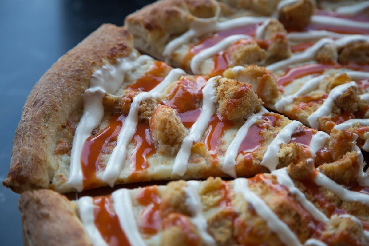 a close up of a slice of pizza