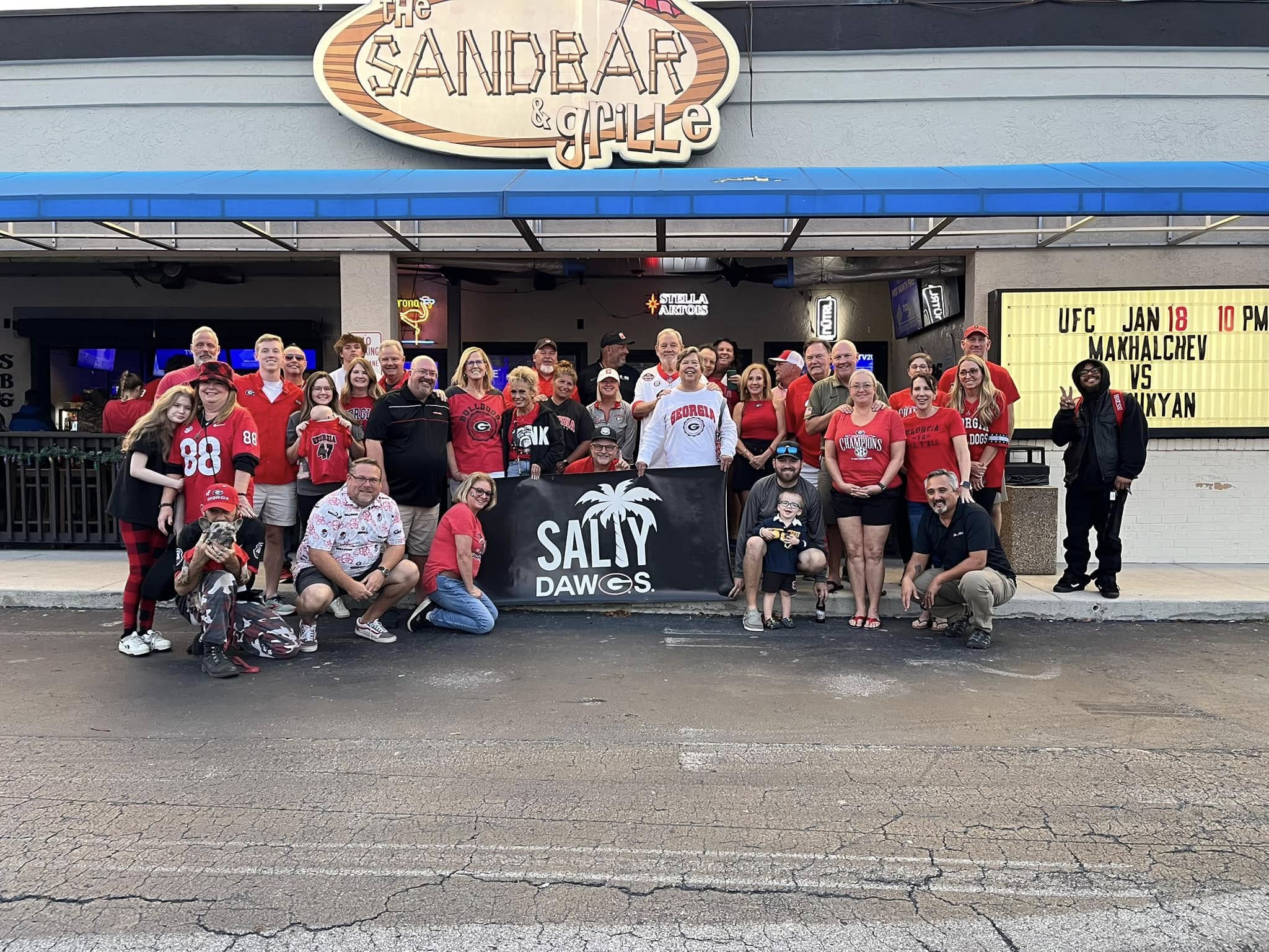 a group of people posing for the camera