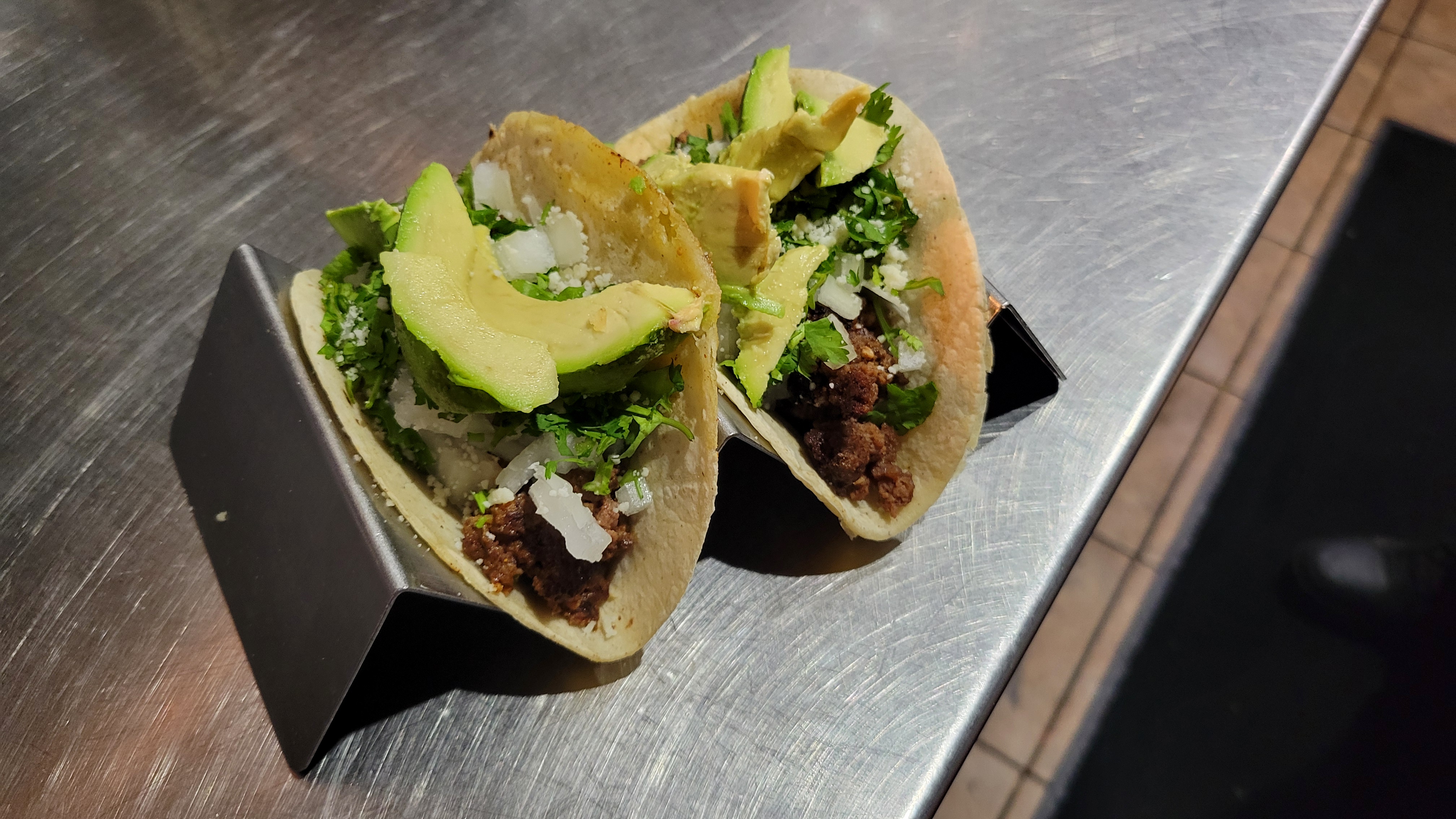 a sandwich sitting on top of a wooden cutting board