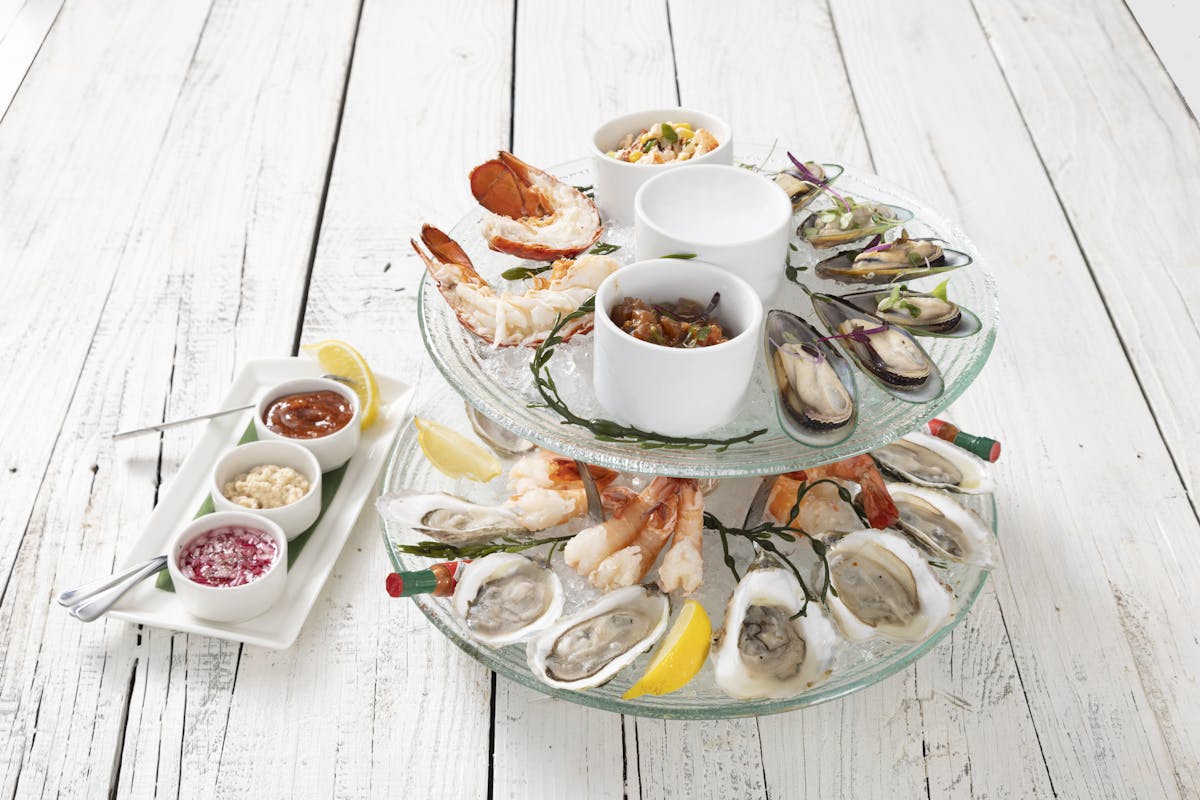 a plate of food sitting on top of a wooden table