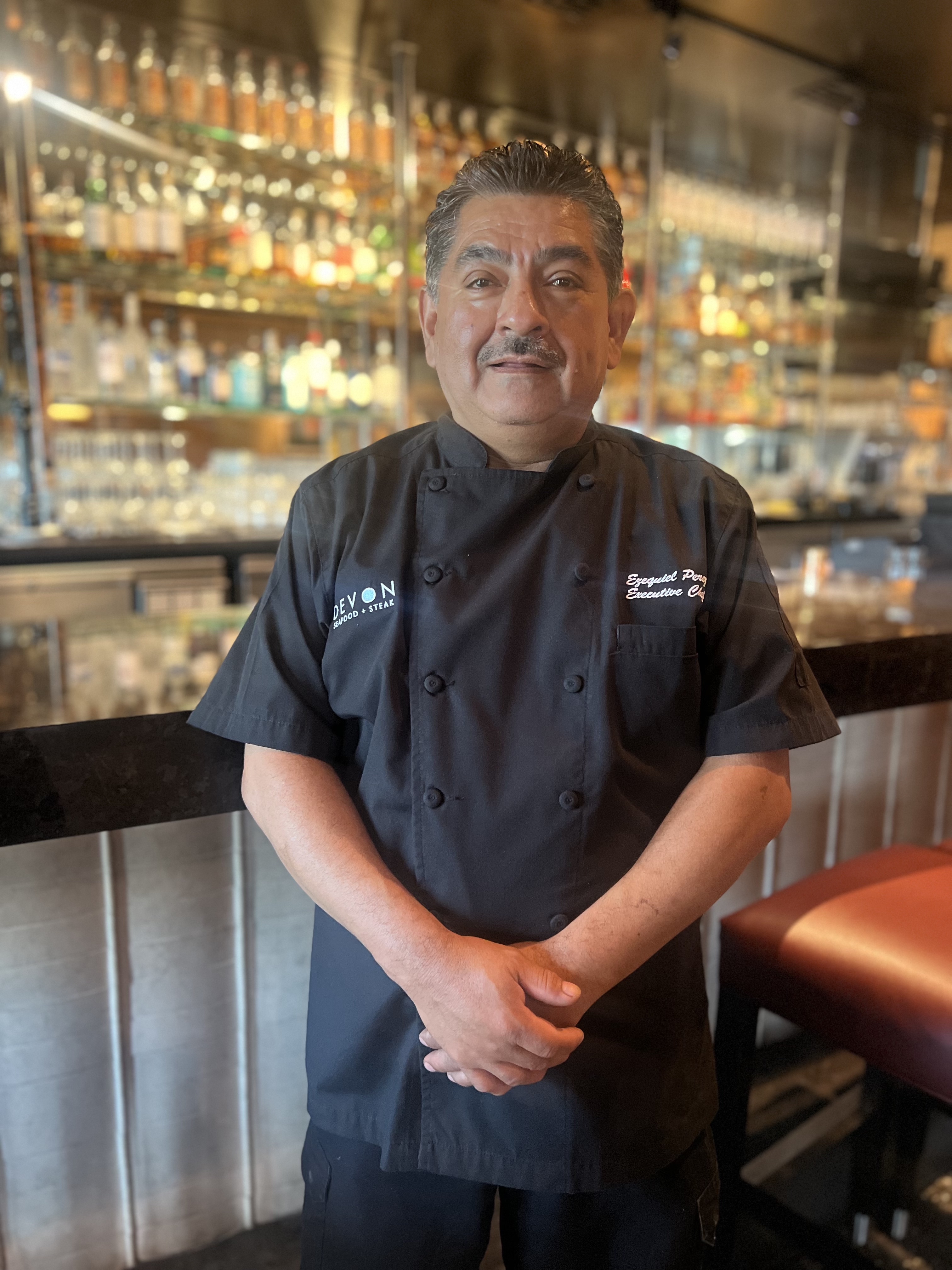 a man standing in front of a store