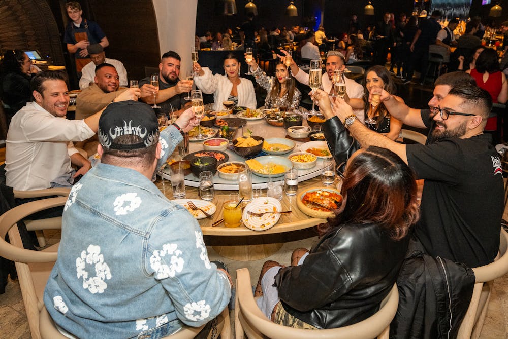 a group of guests at Mijo Modern Mexican doing a toast to the new year!