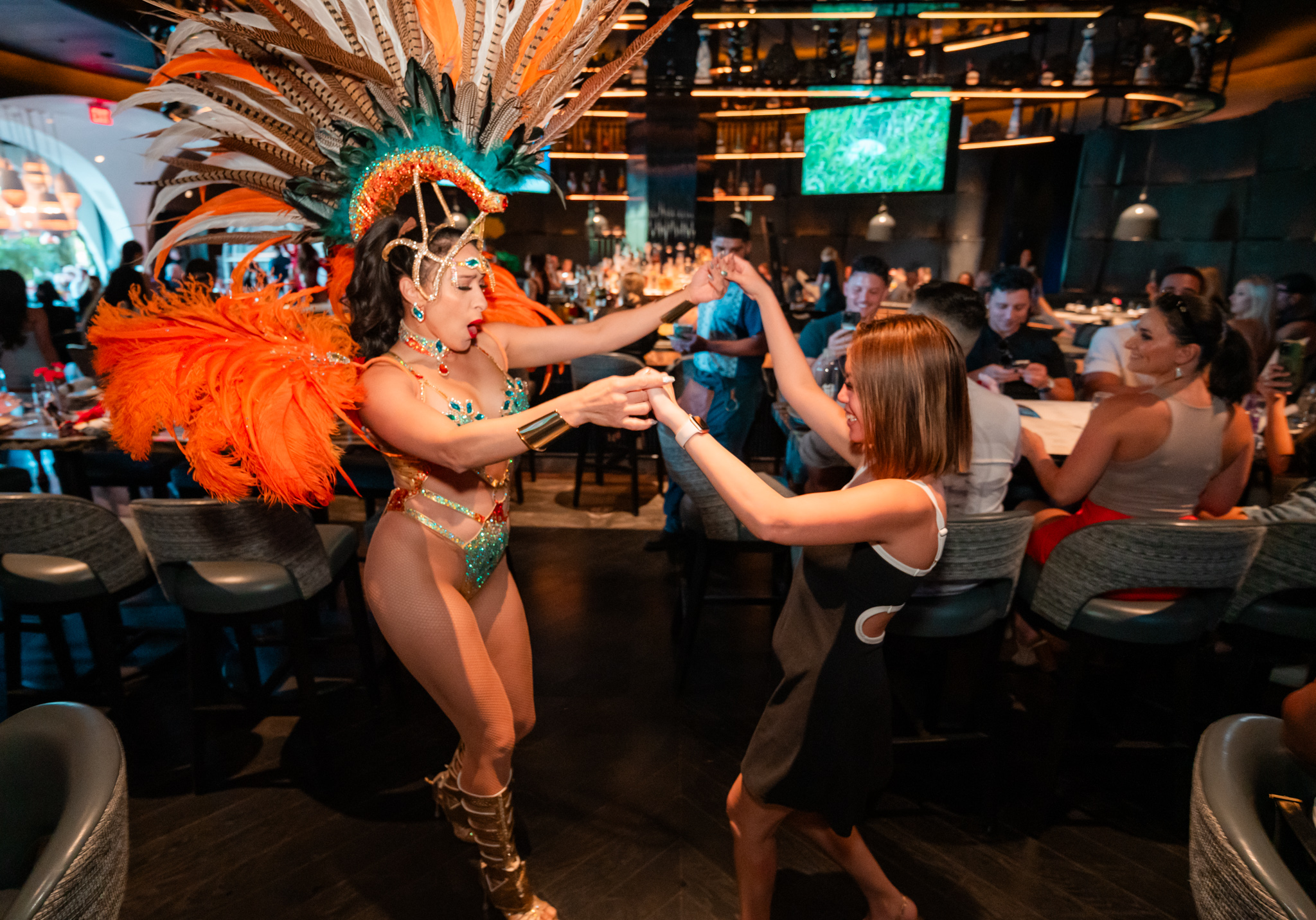 Carnival dancer engaging with guests at Mijo Modern Mexican brunch, a high-energy Las Vegas Mexican restaurant and local Mexican destination for immersive dining and entertainment.