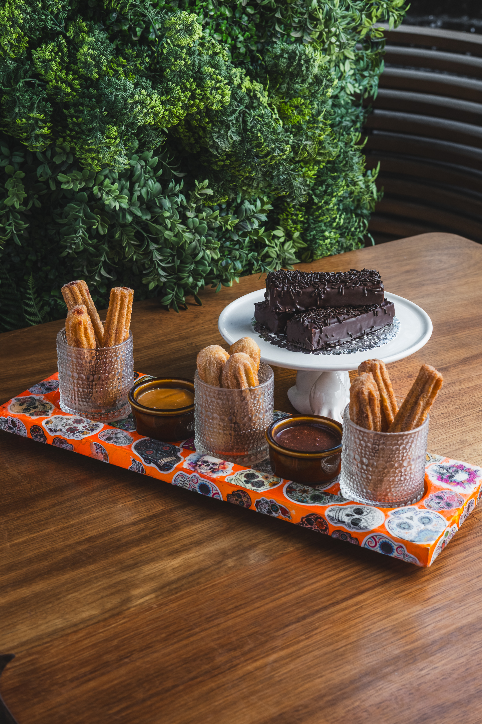 Assorted churros with chocolate, strawberry and dulce de leche sauces alongside chocolate-coated Mexican Twinkies at Mijo Modern Mexican, a Las Vegas Mexican restaurant