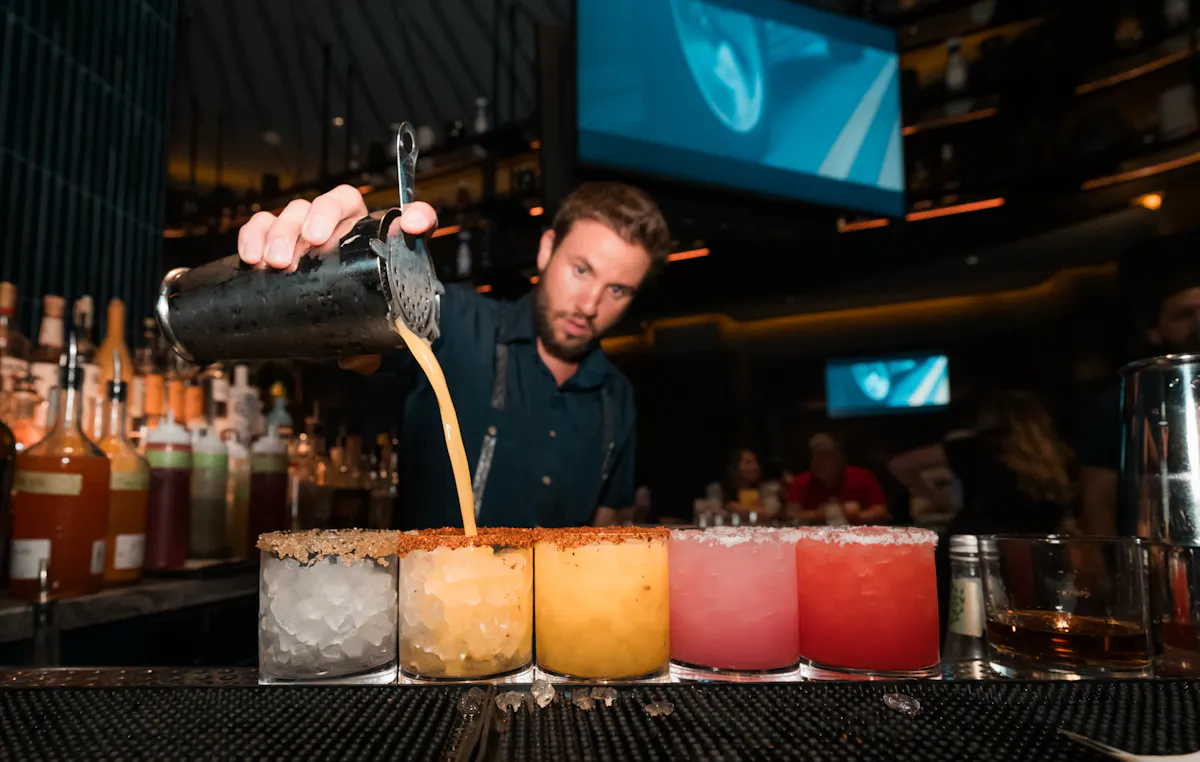 Bartender preparing handcrafted Patrón margaritas at Mijo Modern Mexican, a Mexican restaurant in Las Vegas known for the best margarita Las Vegas, bottomless brunch, and elevated dining.