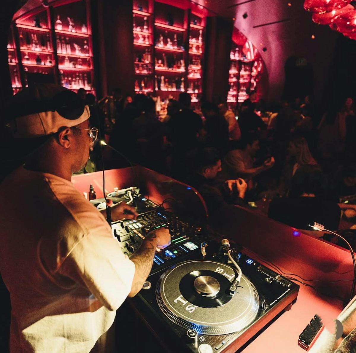 Dj Neek Lopez spinning turntable at Wax Rabbit.