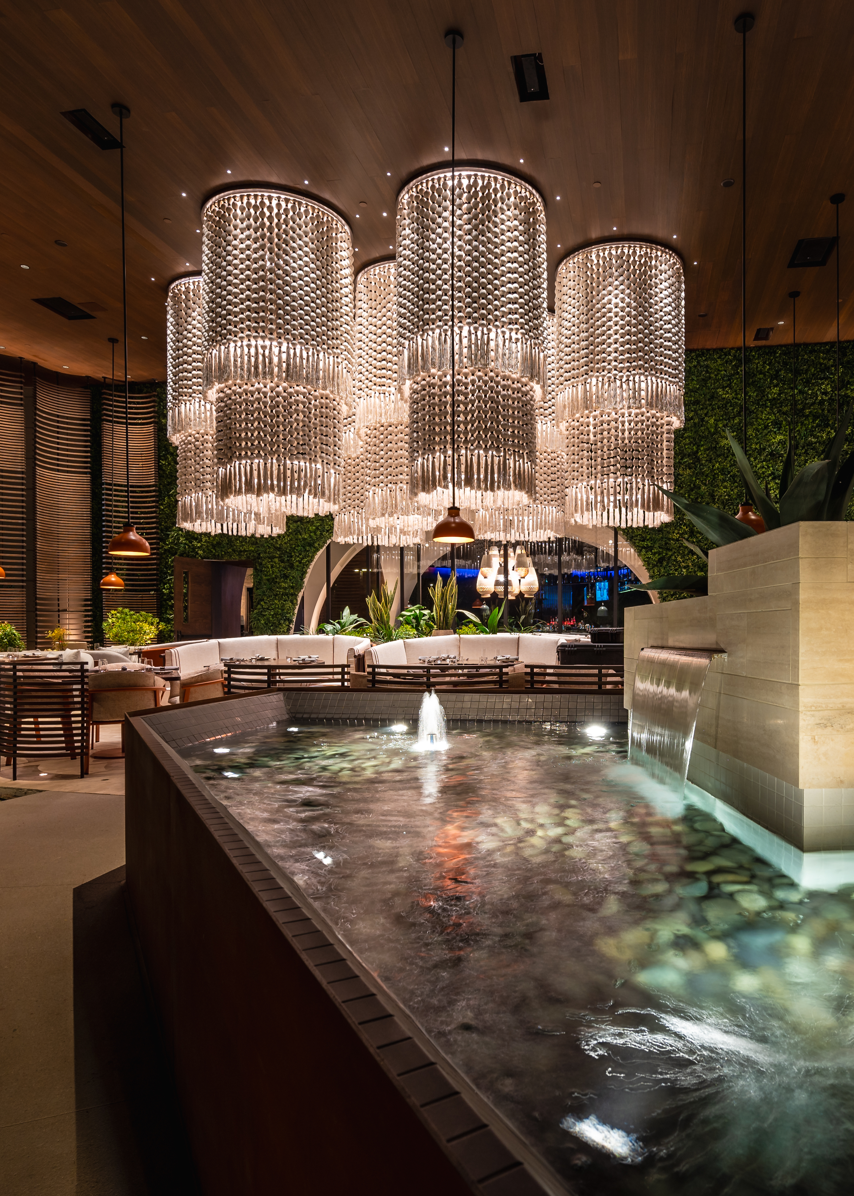 a room filled with furniture and vase of flowers on a table