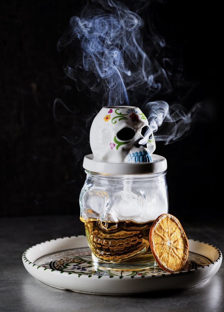 a skull cocktail sold at Mijo Modern Mexican, a Las Vegas Mexican food restaurant that is blowing smoke out of its nostrils