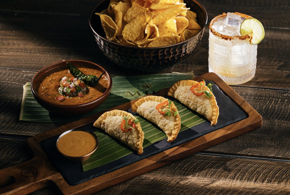 Photo of empanadas served with chipotle aioli