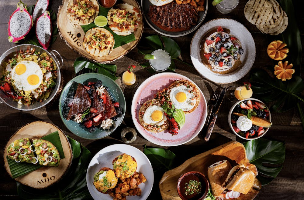 a photo of a brunch spread of brunch items available at mijo
