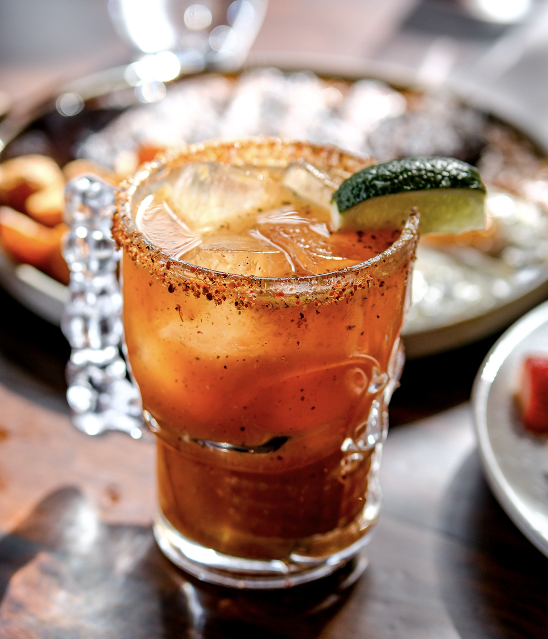 Refreshing michelada served with a Tajín rim and fresh lime at Mijo Modern Mexican, a Vegas Mexican restaurant known for Mexican brunch, handcrafted cocktails, and the best margarita in Las Vegas.