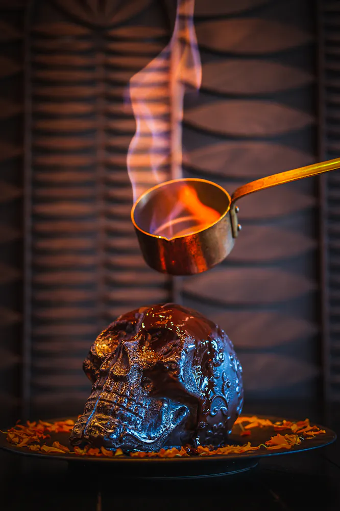 Flaming Diablo Skull En Fuego dessert with chocolate mocha sauce and fire presentation at Mijo Modern Mexican Las Vegas Mexican restaurant