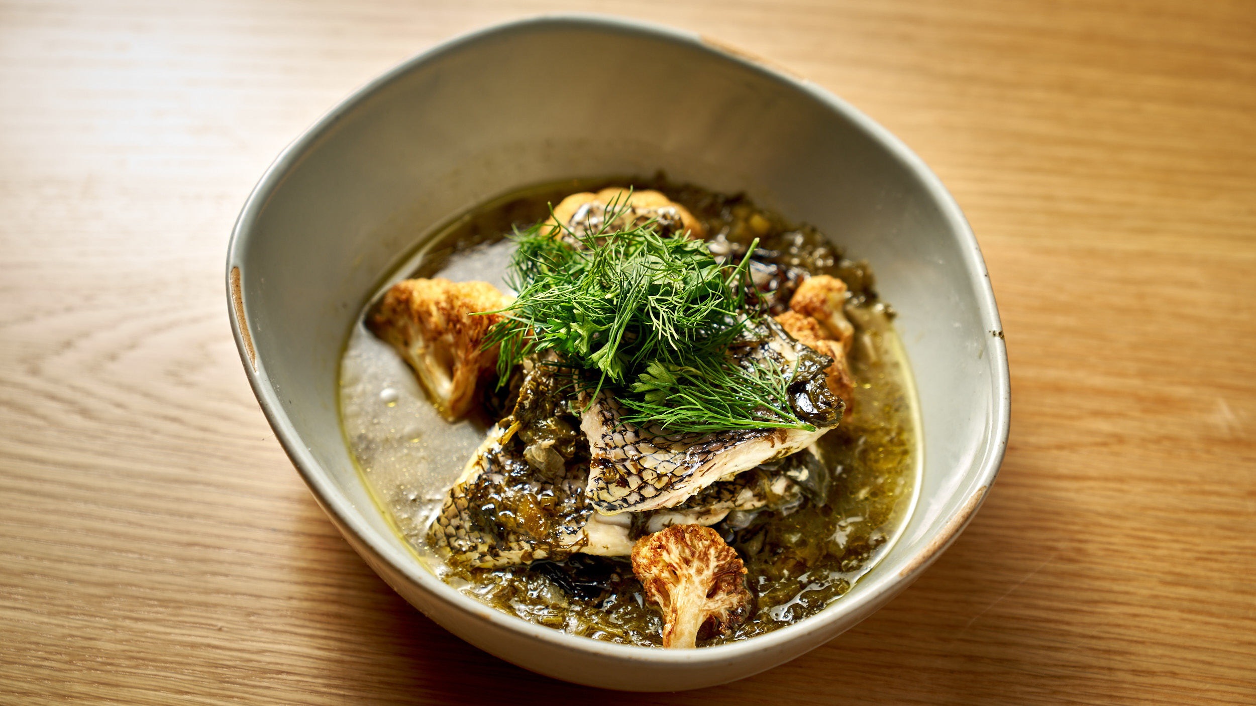 a bowl of food with broccoli