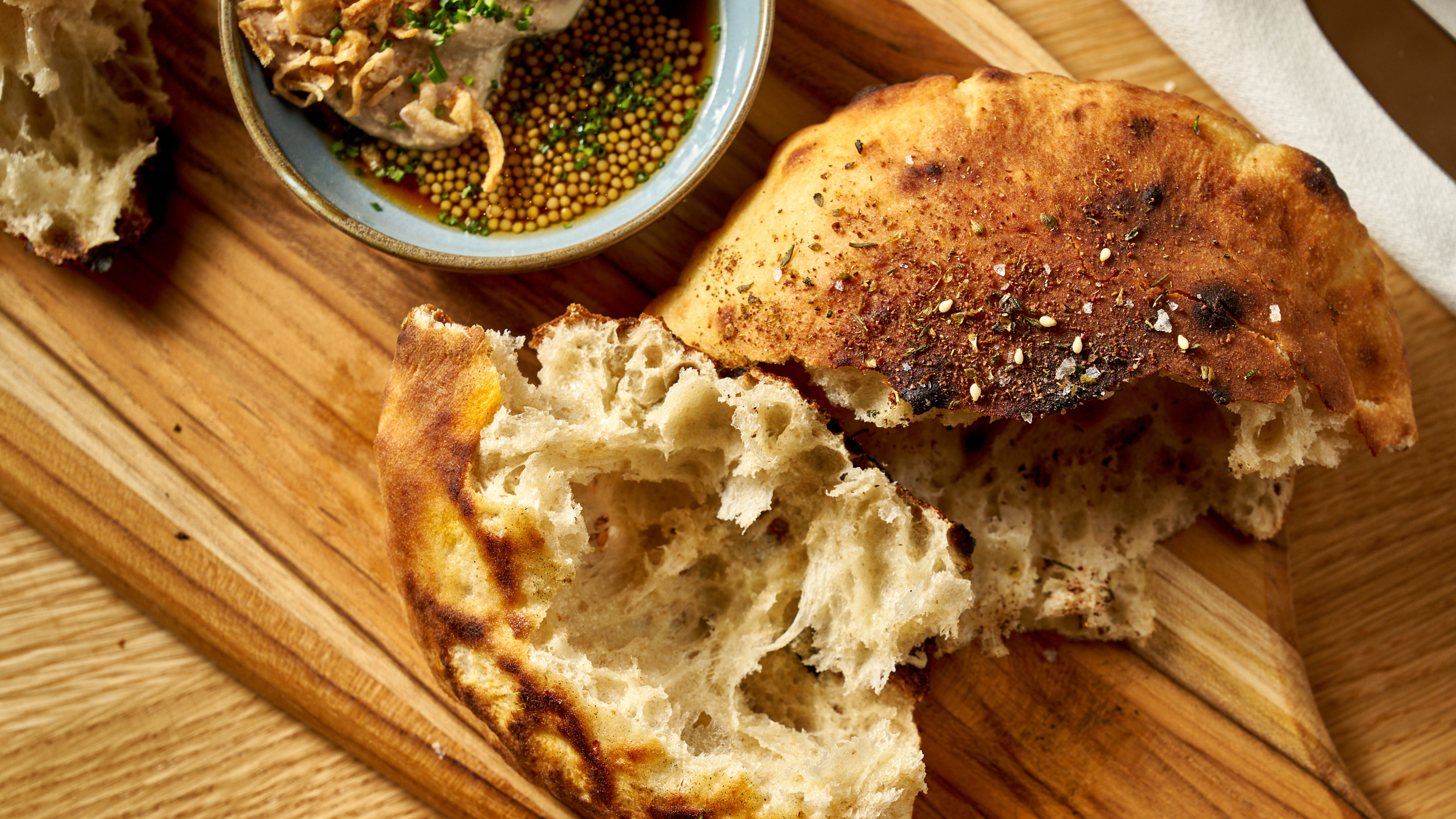 a piece of cake sitting on top of a wooden cutting board