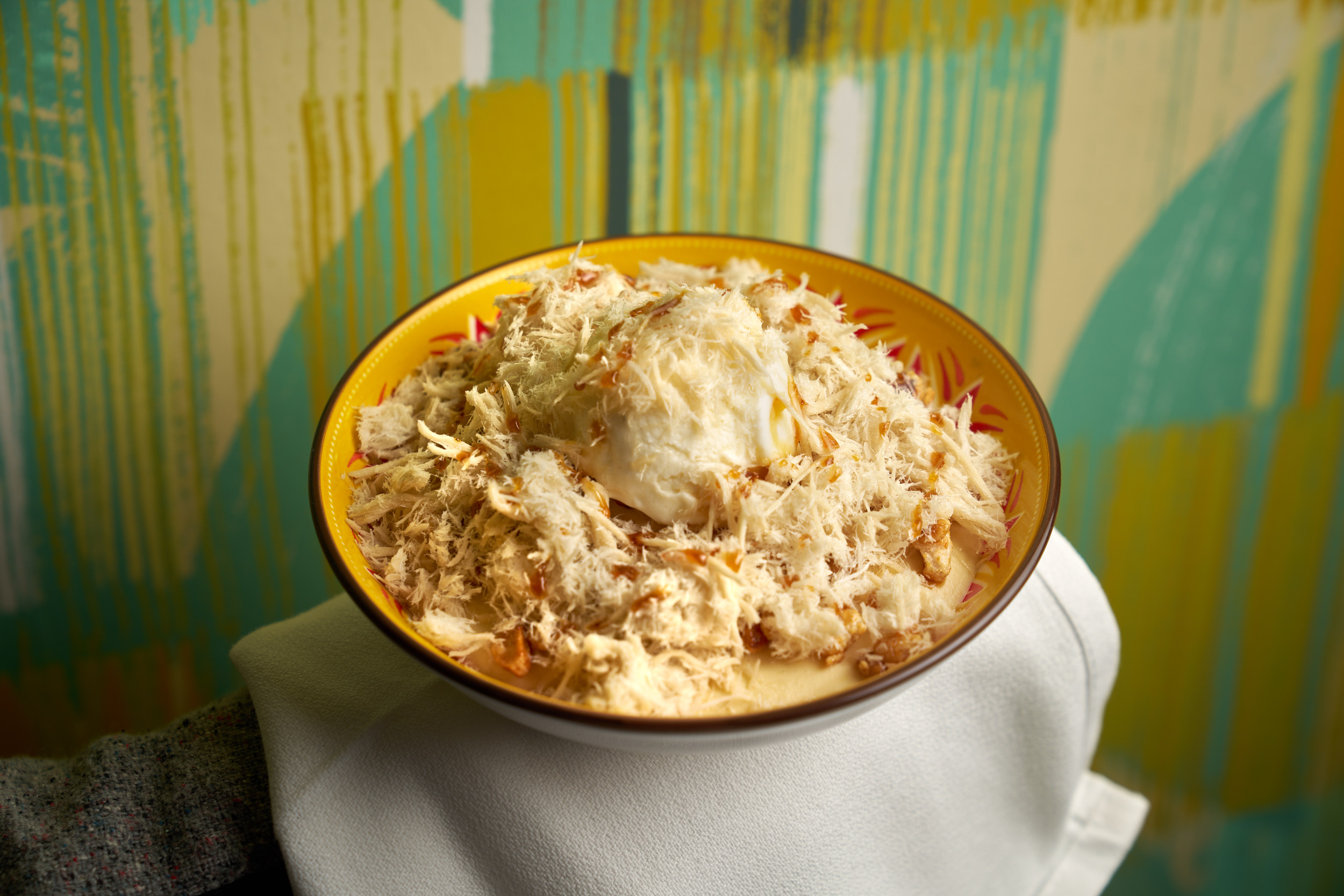 a bowl of food sitting on a table