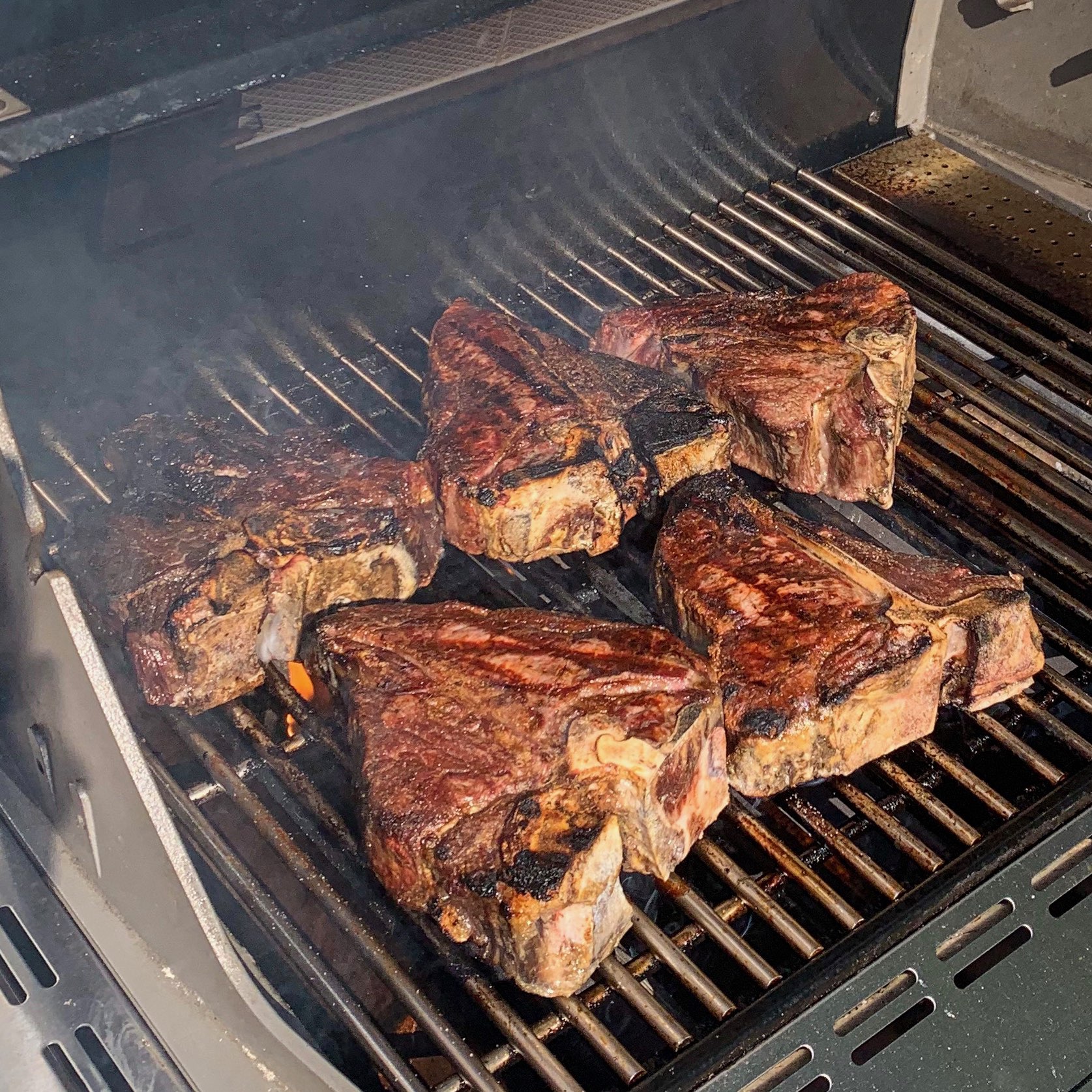 steaks on a grill