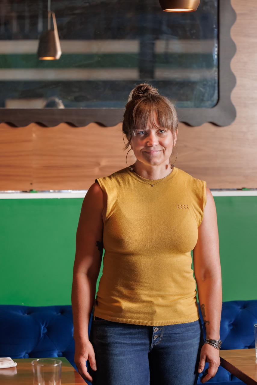 a person standing in front of a table
