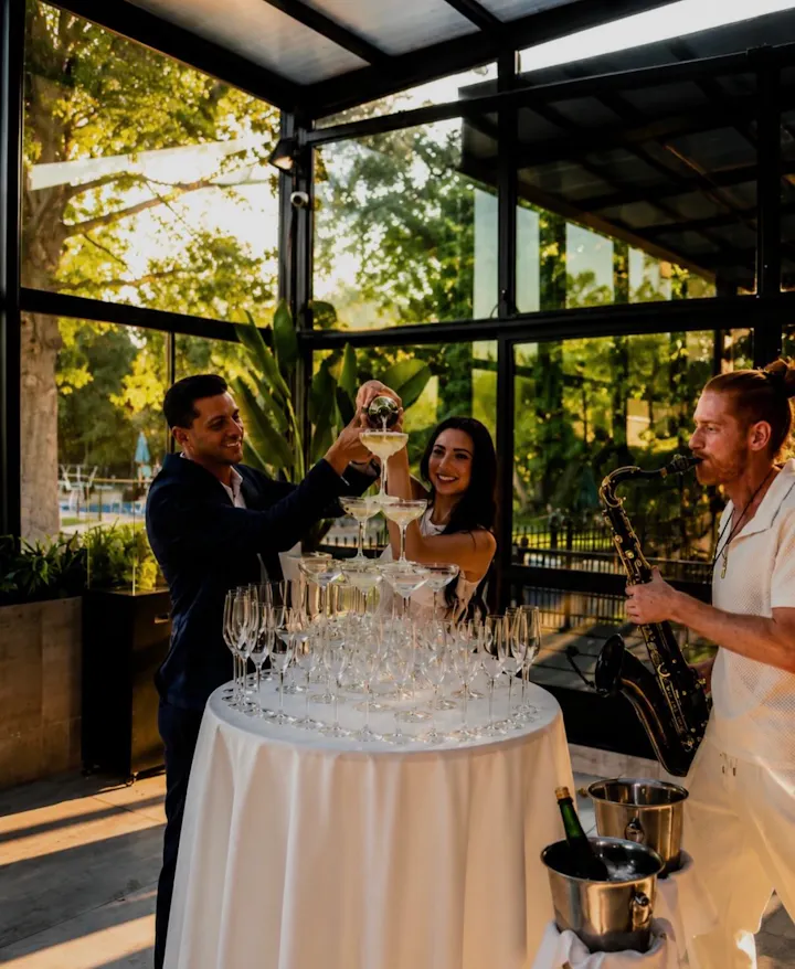 Champagne tower pour with live saxophonist in the G-Room