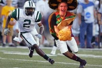 a group of baseball players playing a football game