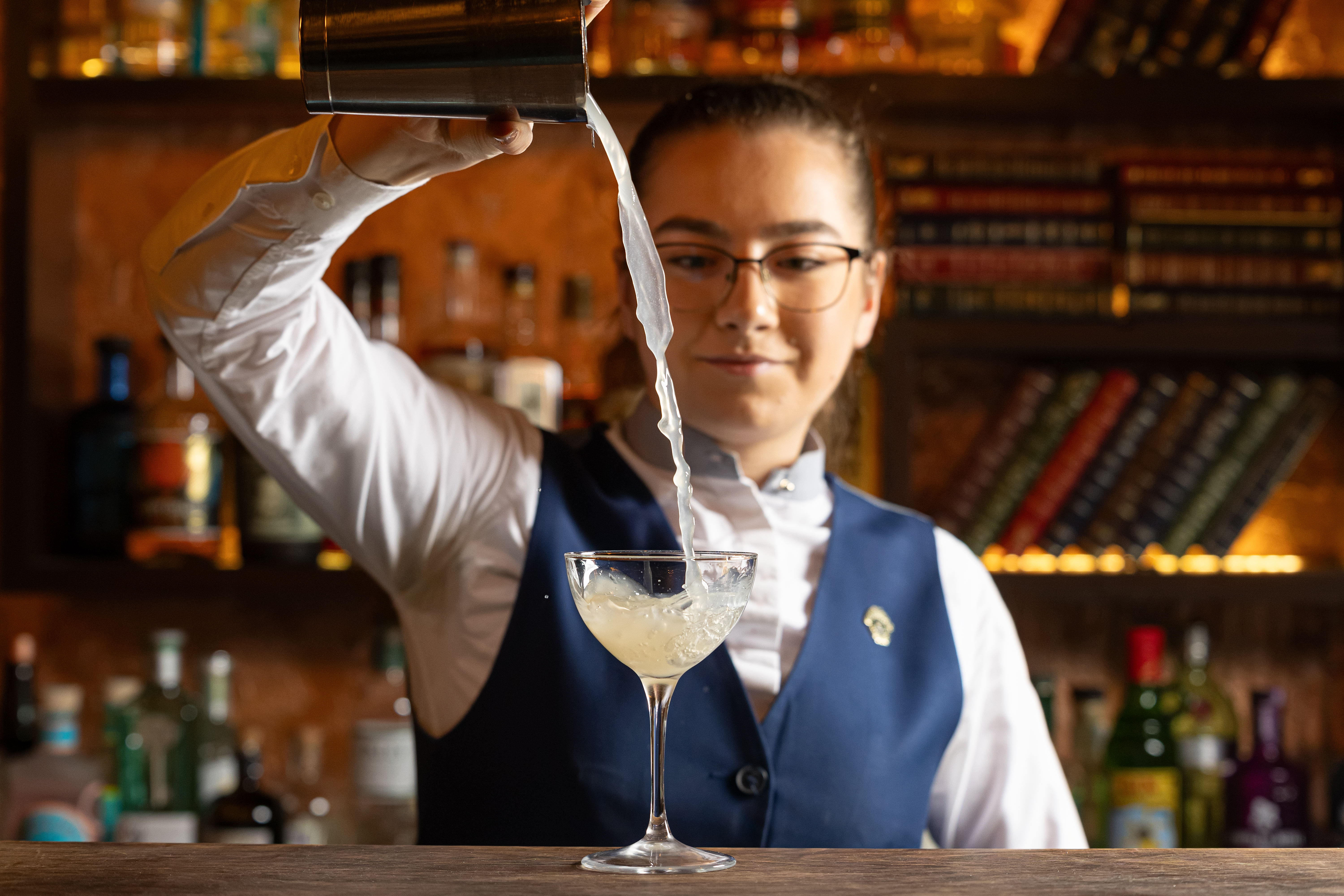 a person holding a glass of wine