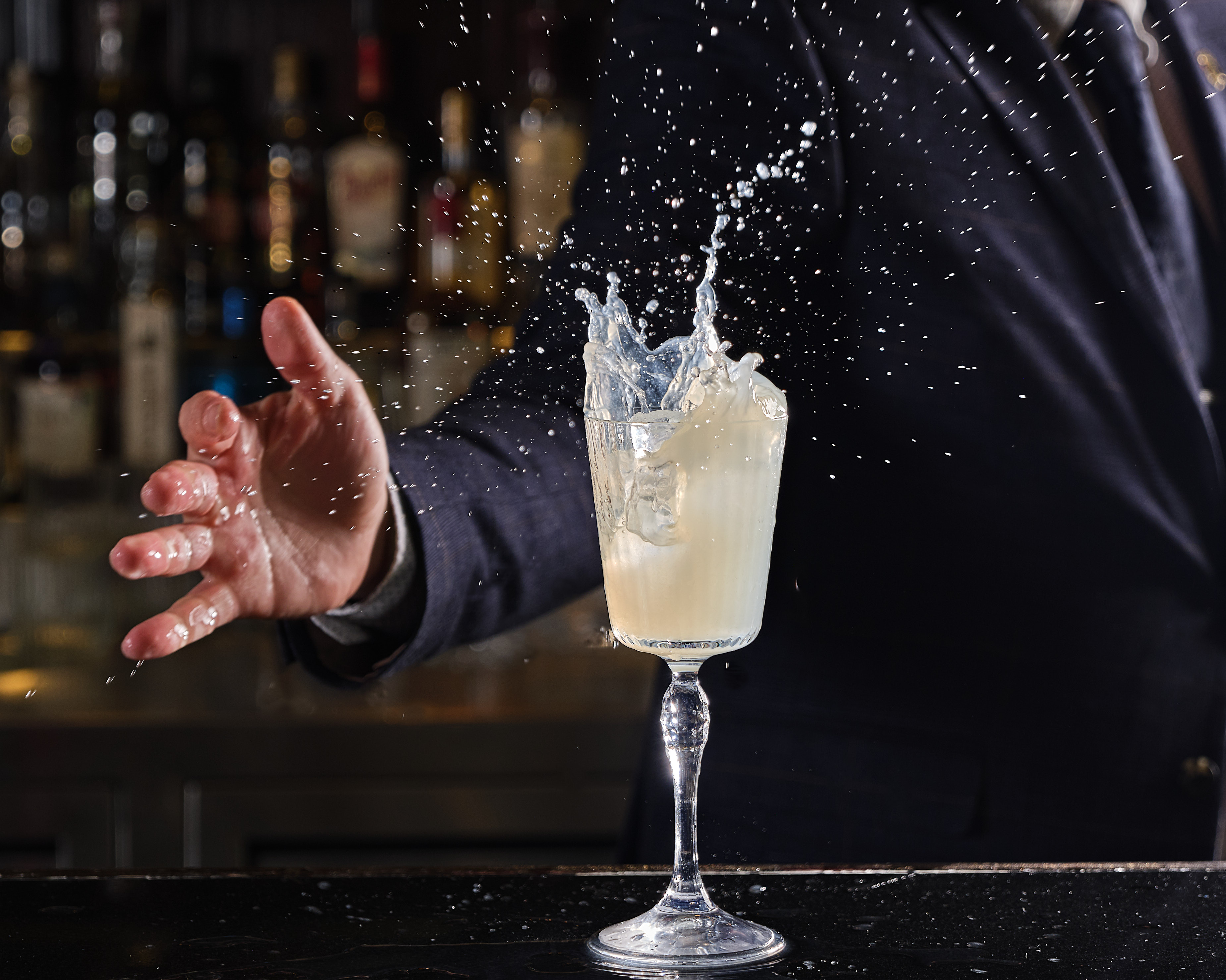 a person holding a wine glass
