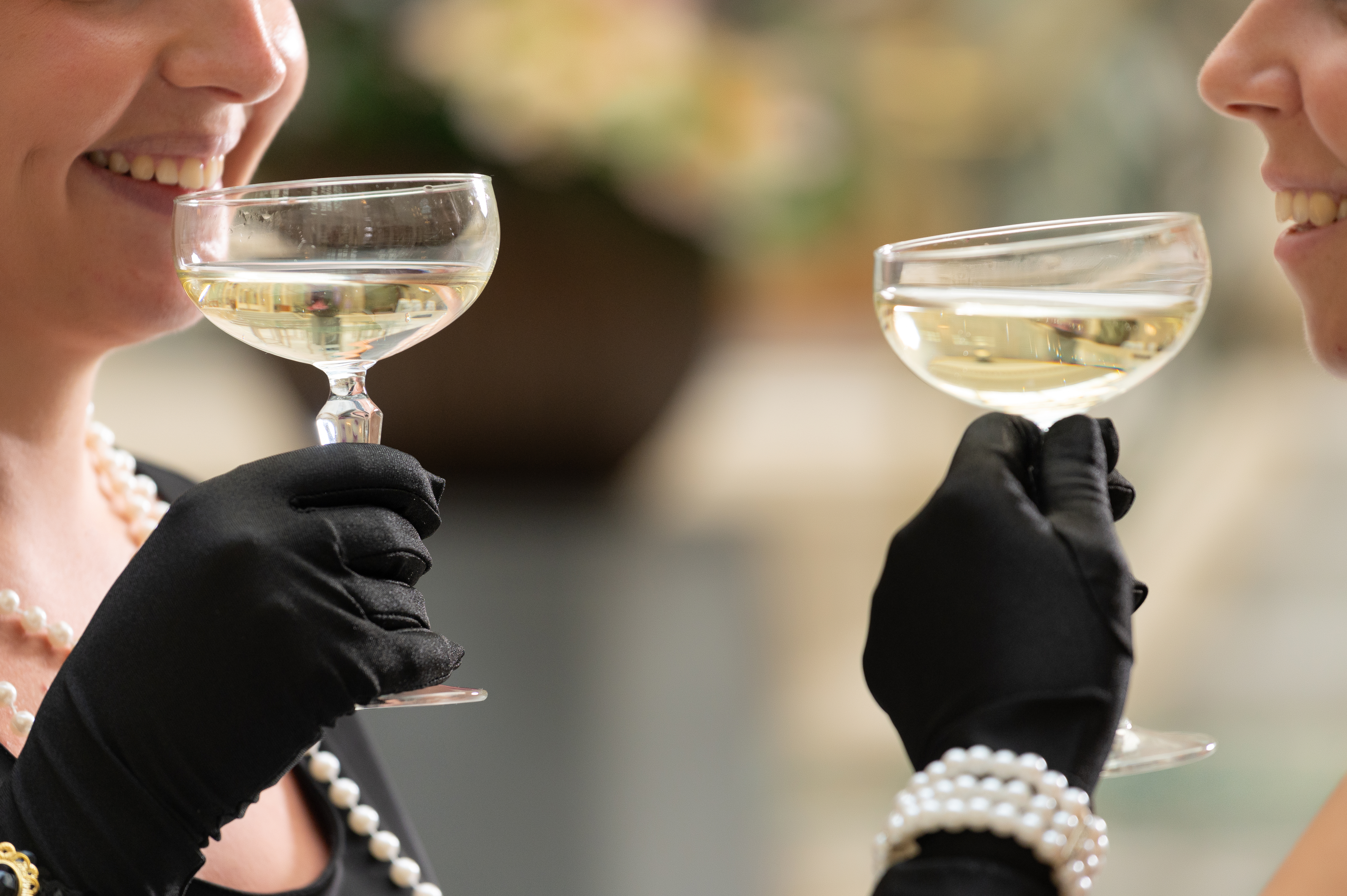a woman drinking from a wine glass