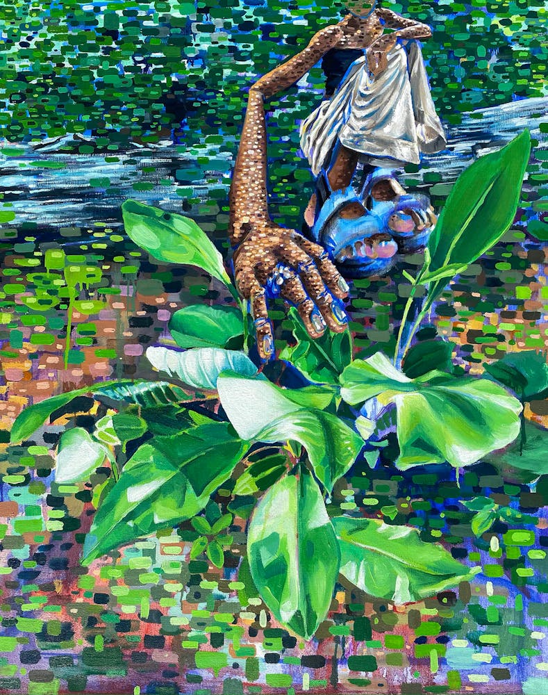 a pond surrounded by green leaves