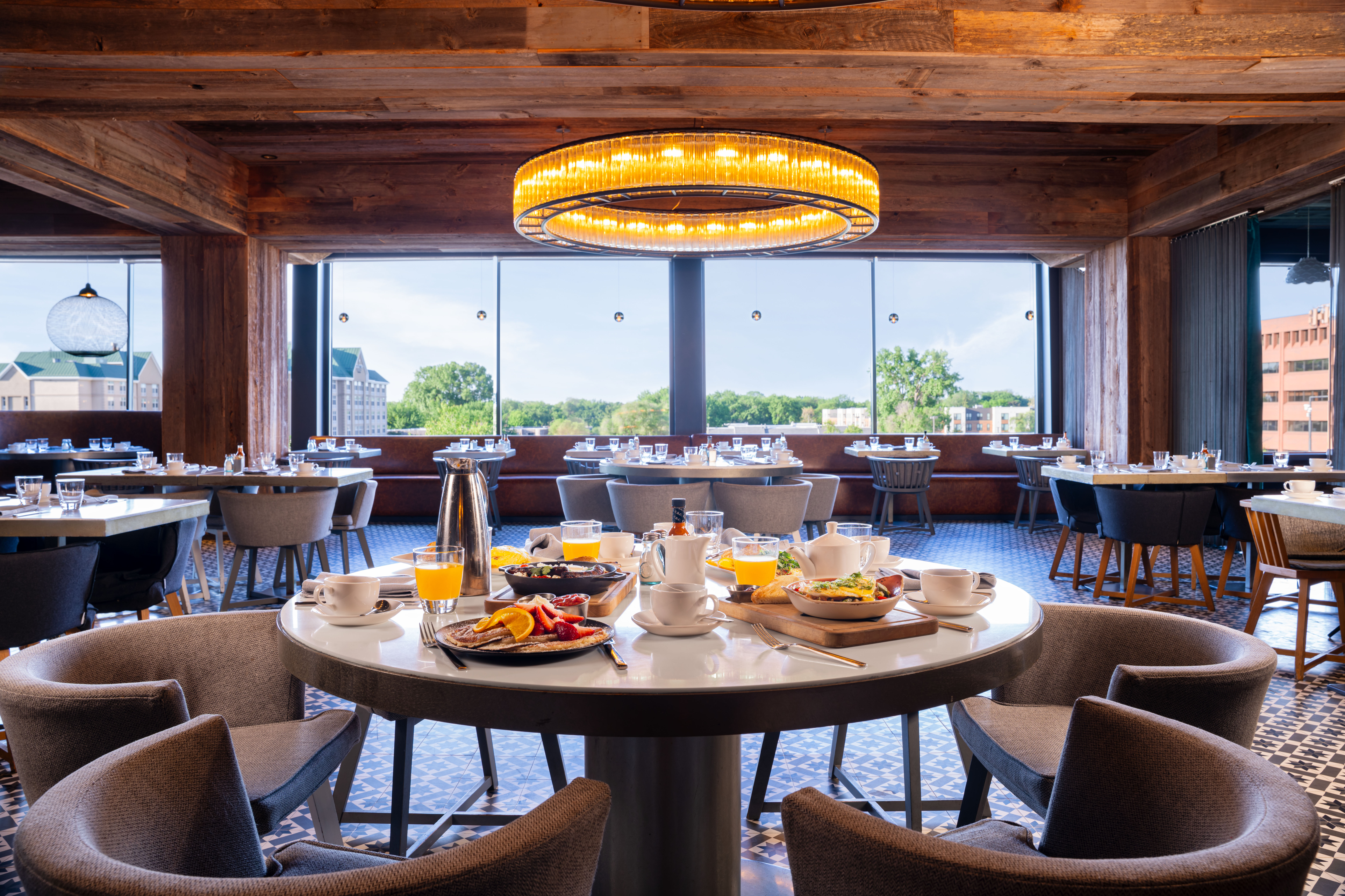 a room with a table with food and chairs