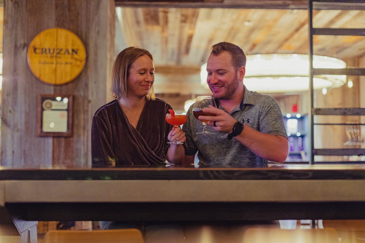 A couple enjoying a drink in FireLake Cocktail Bar