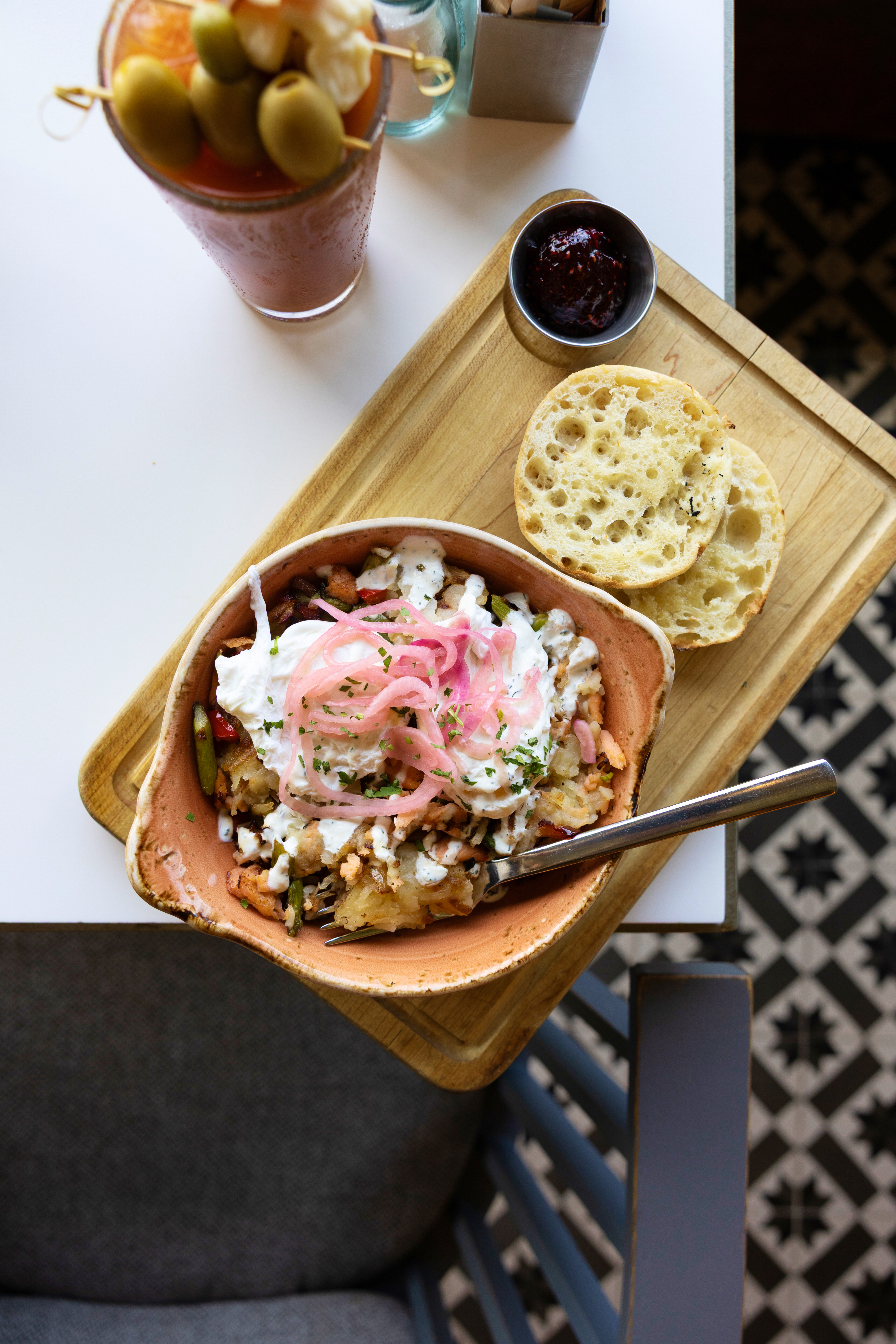 a bowl of food on a wooden tray