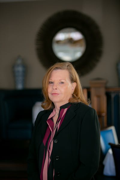 a woman wearing a suit and tie