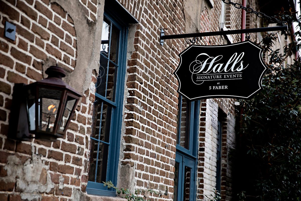 a sign on a brick building