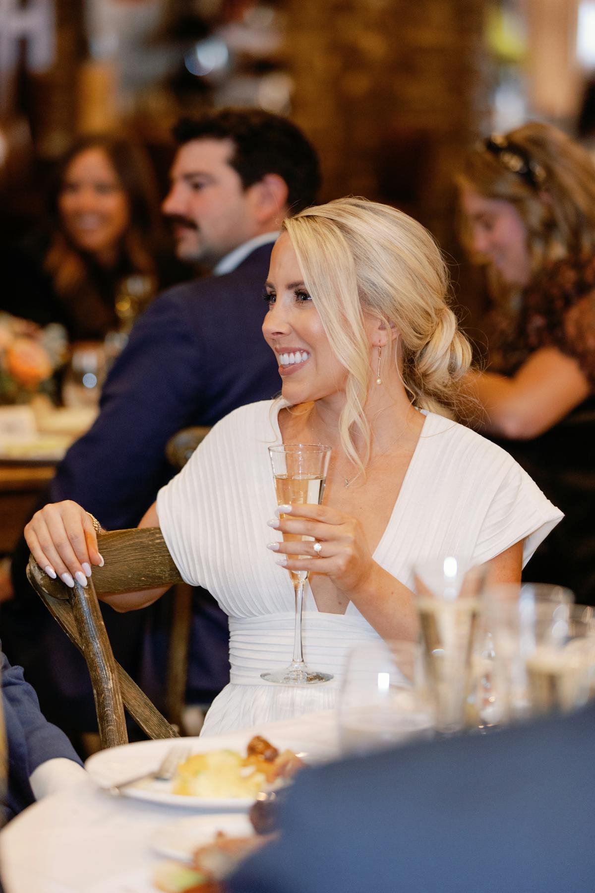 a person sitting at a table eating food
