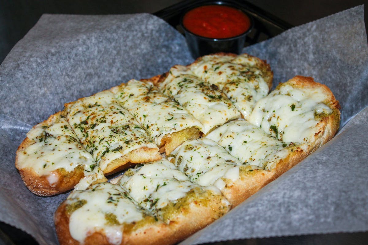 a slice of pizza sitting on top of a wooden table