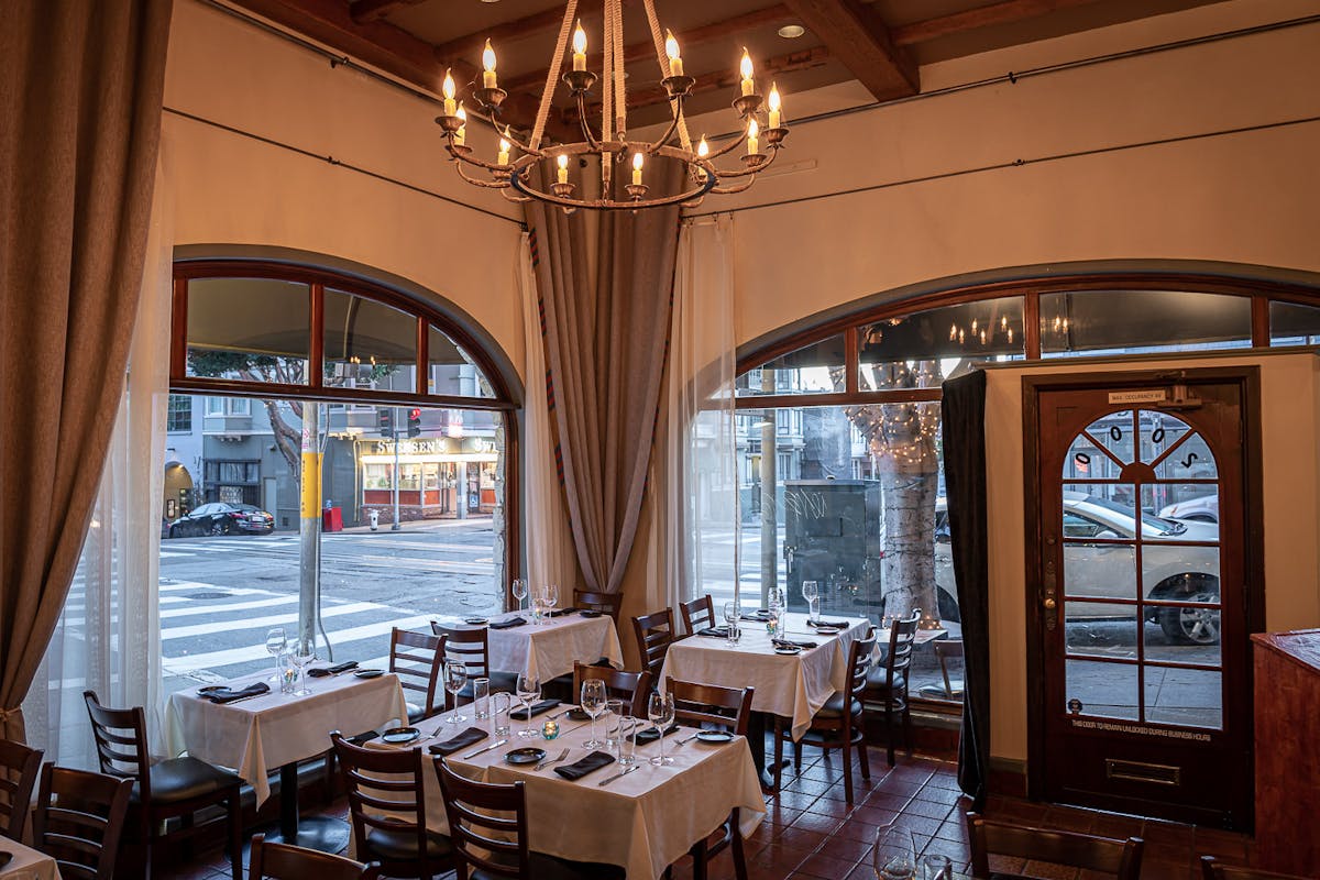 a dining room table in front of a window