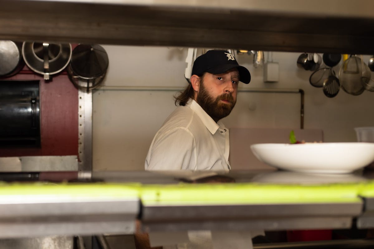 a man cooking in a kitchen