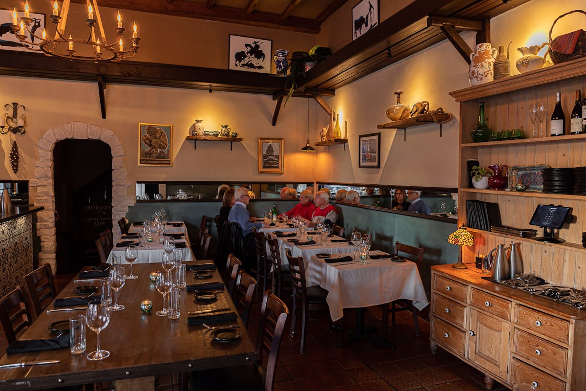 a room filled with furniture and a table in a restaurant