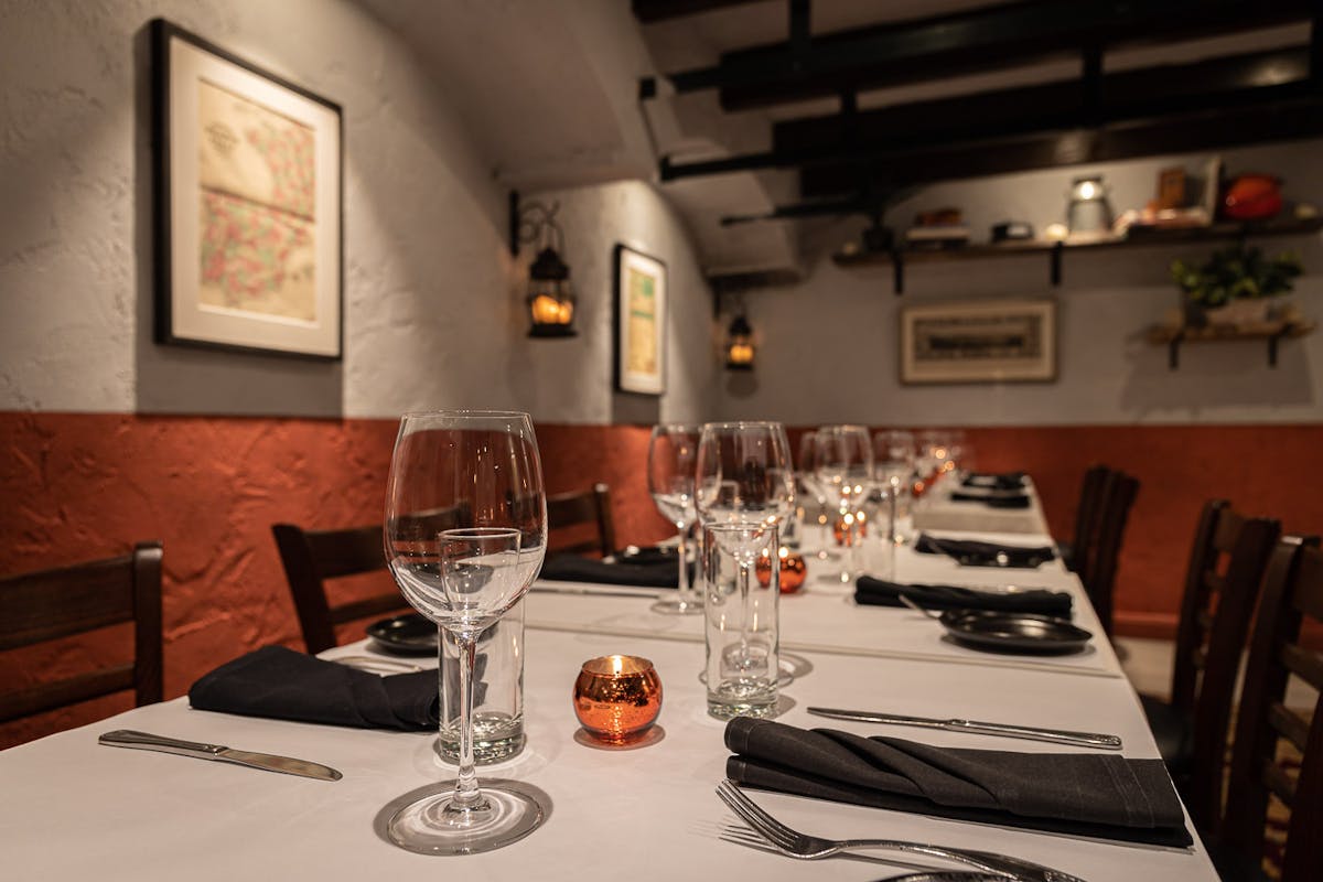 a dining table filled with wine glasses