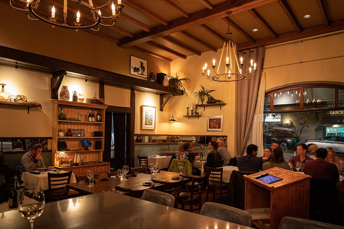 a room filled with furniture and a table in a restaurant