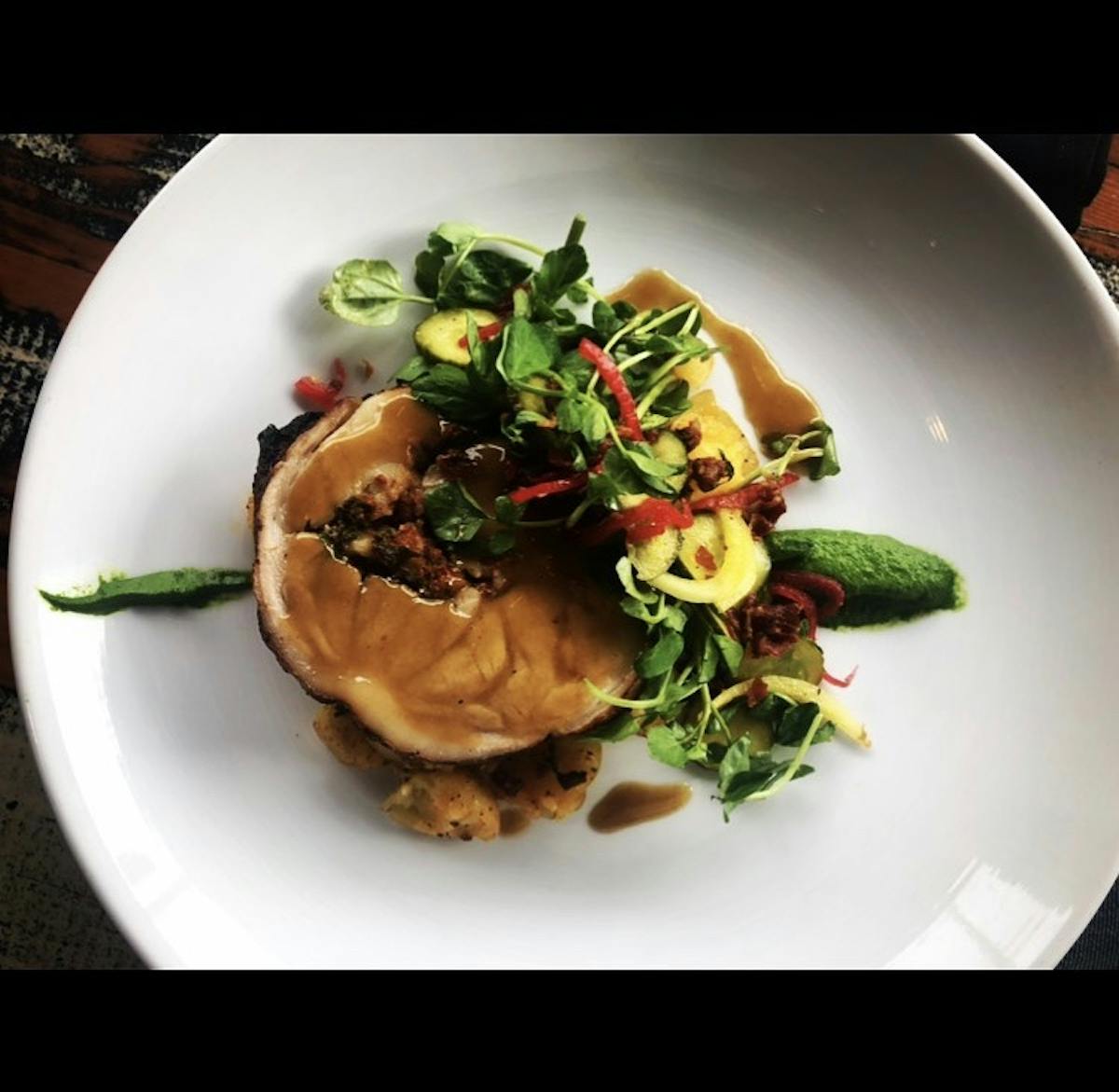 a white plate topped with different types of food on a table