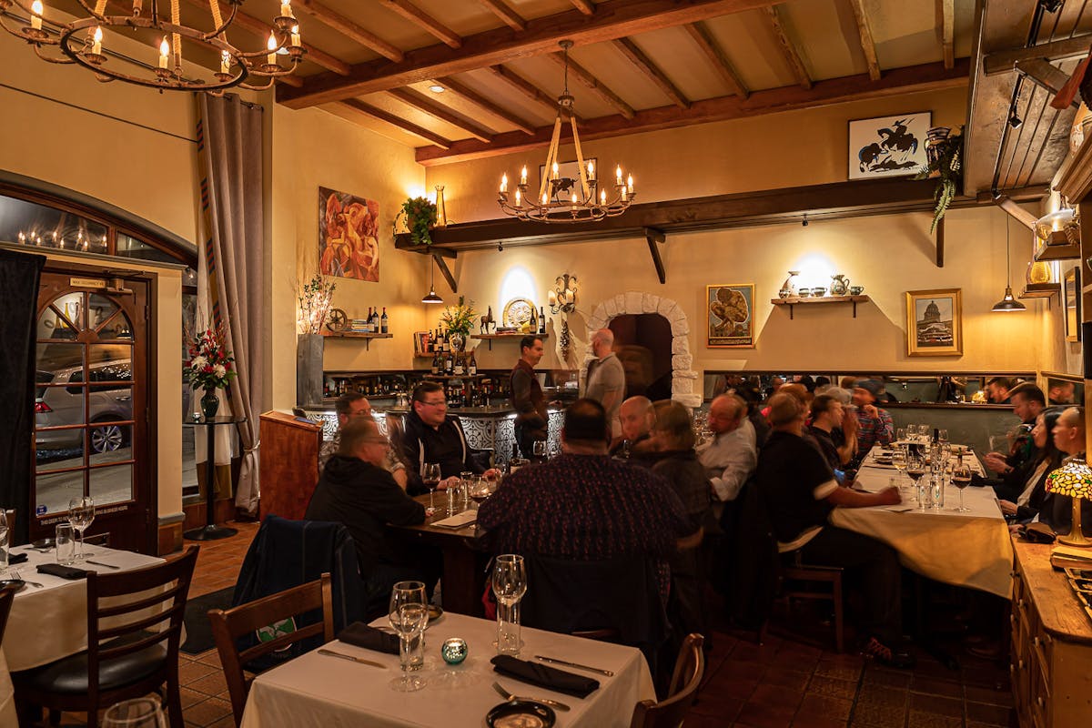 a person sitting at a table in a restaurant
