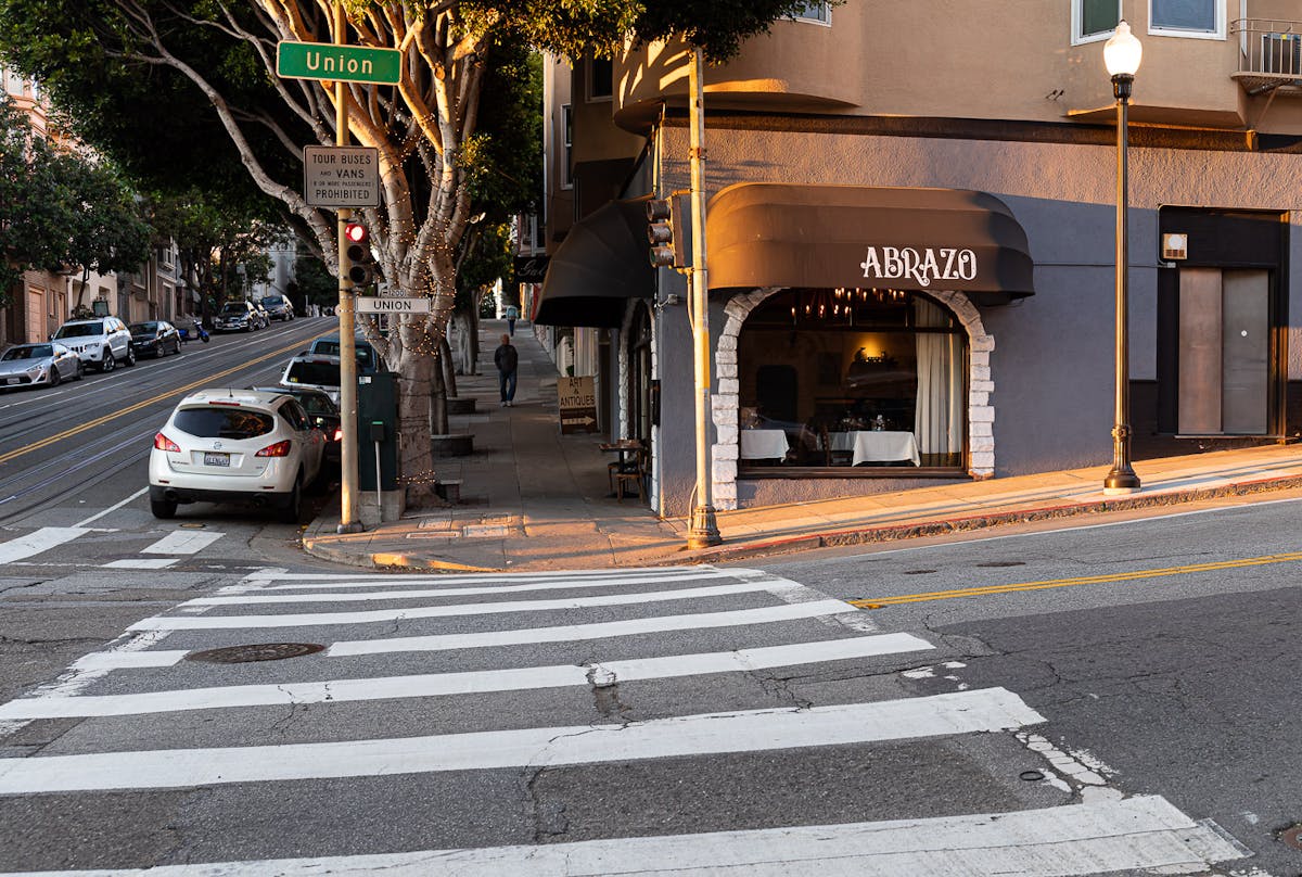 a street scene with focus on the side of a building