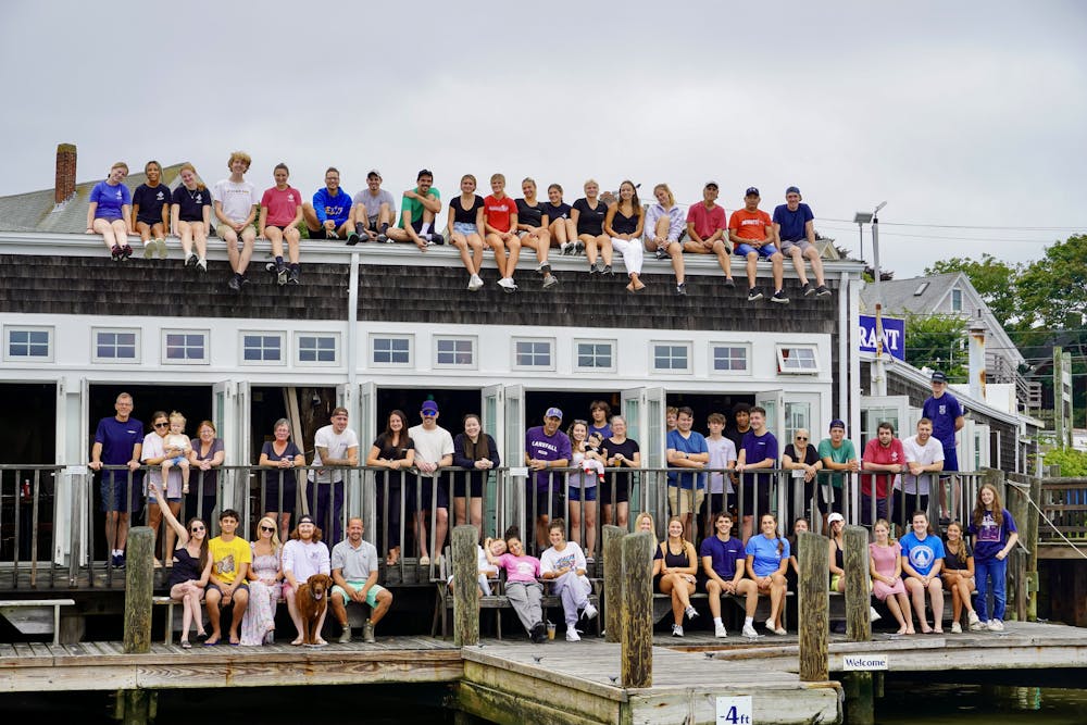 a group of people standing in front of a crowd