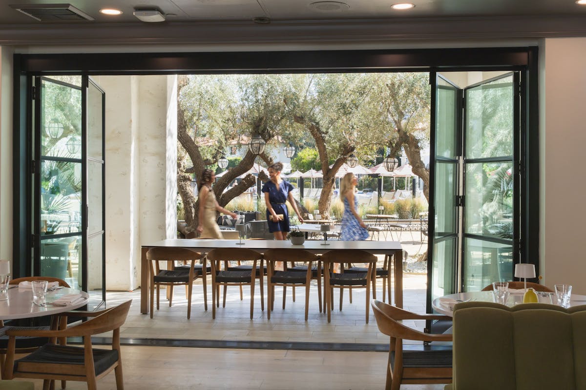 a dining room table in front of a window