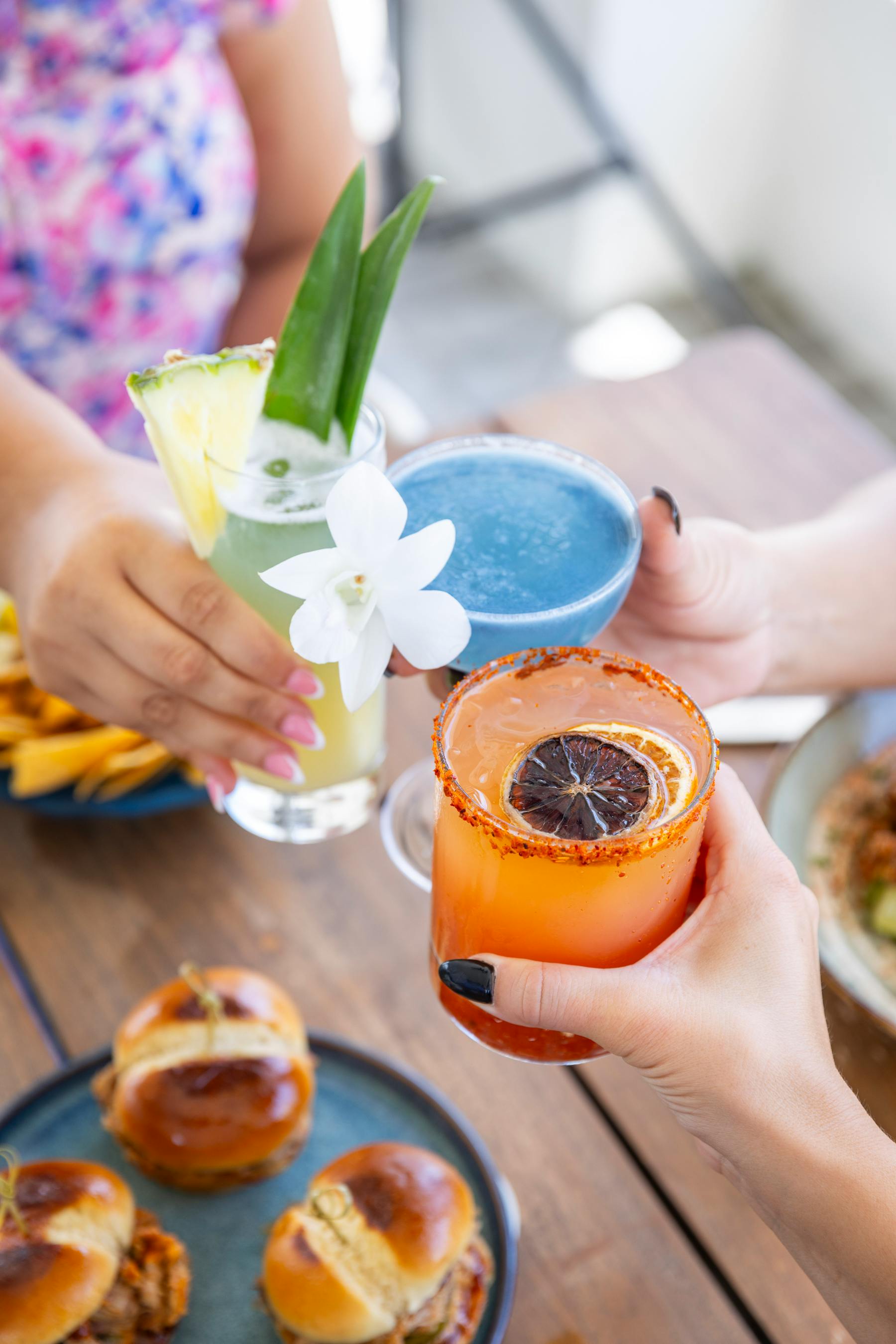 a group of people holding drinks