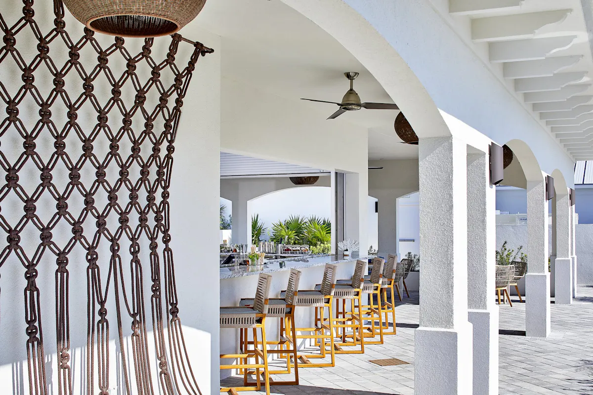 a dining room table in front of a fence
